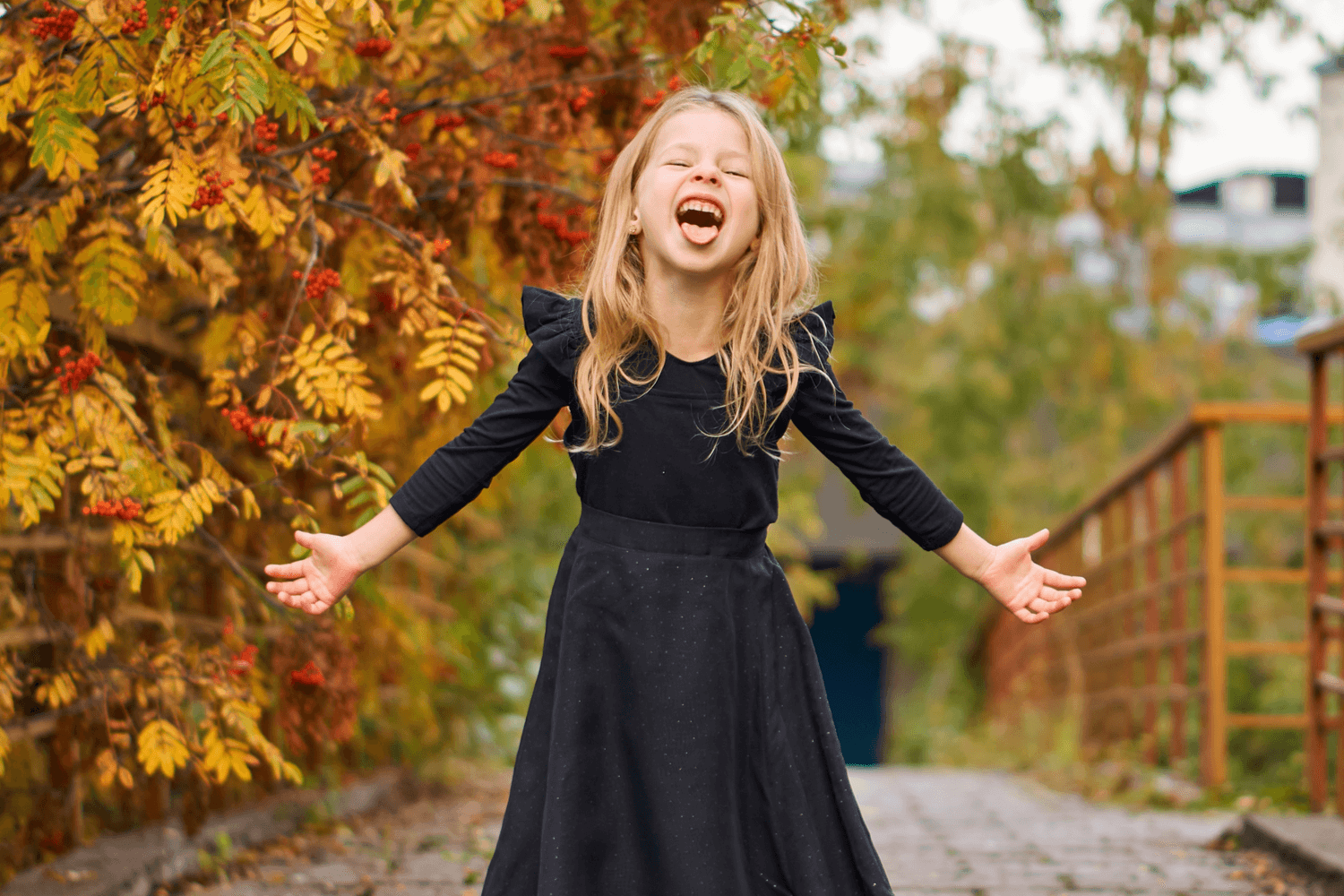 A little girl dressed up as a witch laughing
