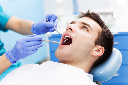 Man getting a dental exam in Tennessee