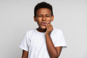 Young boy with tooth ache